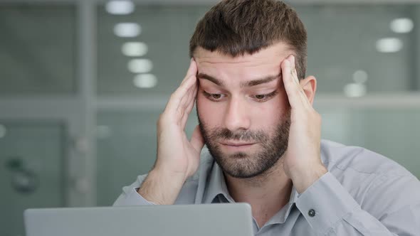 Closeup Tired Pensive Businessman Looking at Laptop Screen Suffering From Overwork Feeling Headache