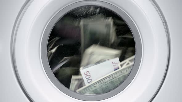 Drum of a Washing Machine, Money and Dollars Are Spinning and Laundered