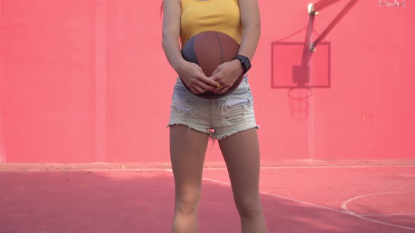 Attractive Athletic Woman on the Street Basketball Court