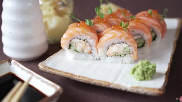 Sushi set with salmon and red caviar, beautifully presented on the table