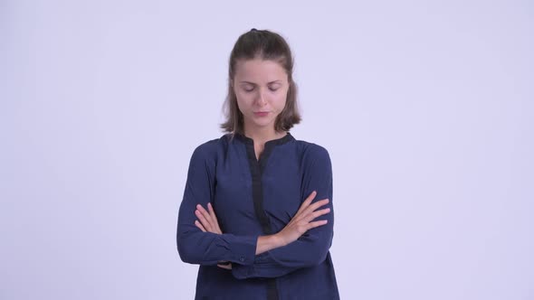 Angry Young Businesswoman with Arms Crossed