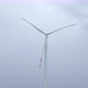 Engineers shake hands against wind turbine generating electricity on windmill. - VideoHive Item for Sale