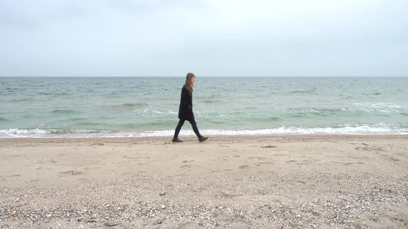 The Girl Walks on the Beach