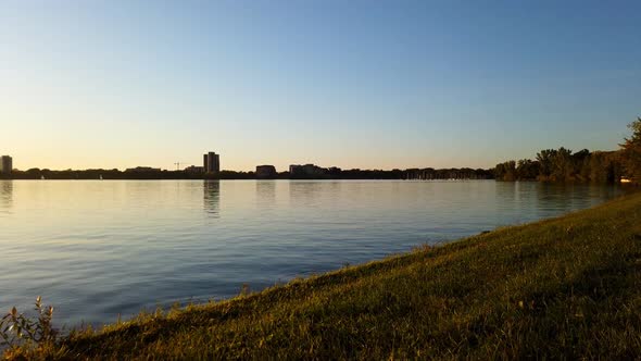 Sunset timelapse at lake, motionlapse during golden hour