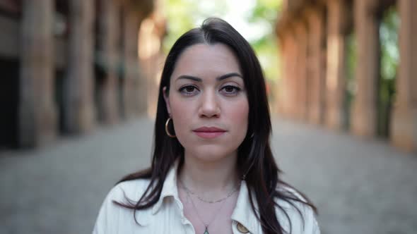 Confident brunette woman looking at the camera