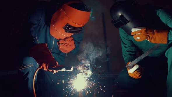 Metal Welder Working with Arc Welding Machine