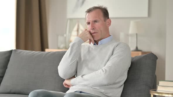 Exhausted Middle Aged Businessman Having Nap on Sofa