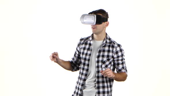 In Virtual Reality Glasses Man Viewing Information, Flips Through Slides