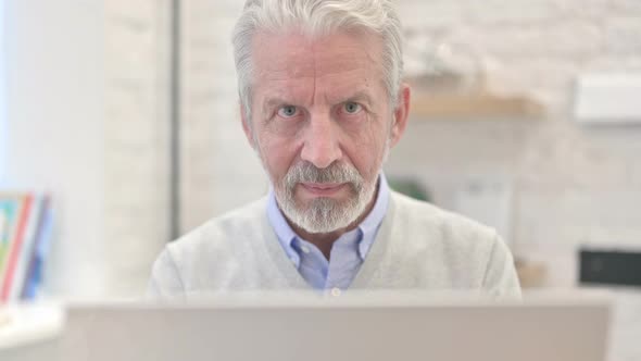 Close Up of Smiling Old Man Looking at Camera