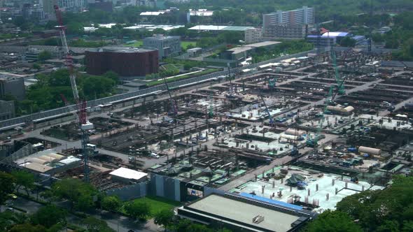 Large Construction Site with Heavy Construction Machinery in Metropolis