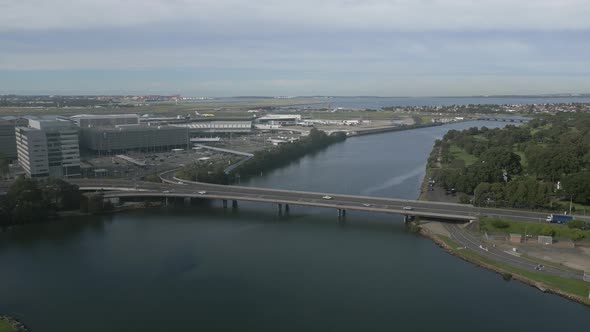 Two lane bridge highway at Sydney International Airport. Australia. Static aerial view on a cloudy d