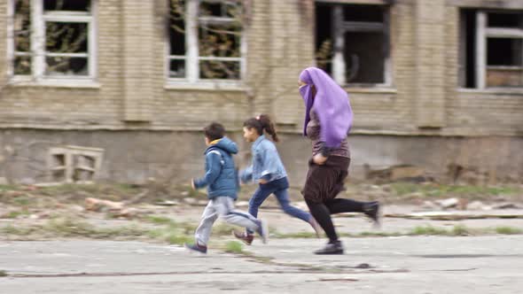 Middle-Eastern Woman with Kids Running