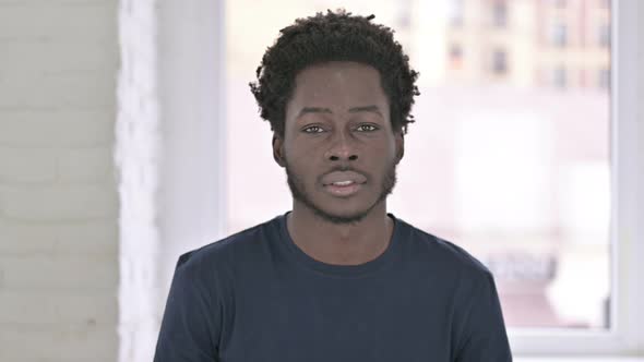 Portrait of Young African American Man Looking at the Camera