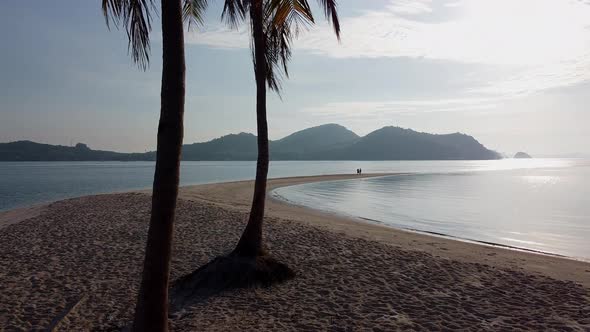 Couple standing at Laem Had beach, Thailand