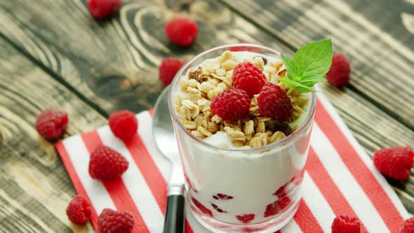 Served Yogurt with Raspberry on Napkin