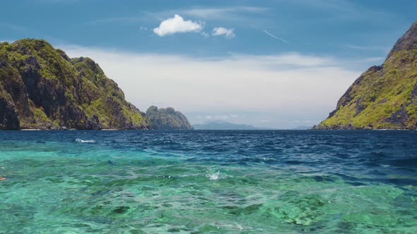 Ocean Strait Rippled Surface Between Matinloc and Tapiutan Islands. Island Hopping Tour C. Bacuit