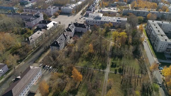 Aerial view of park next to house of culture and three-story and five-story houses 53