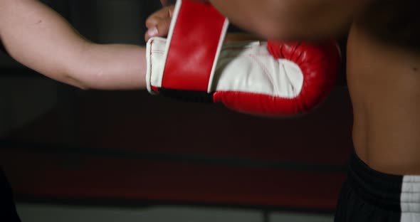 Coach Helps Women Boxer To Put On Gloves 17