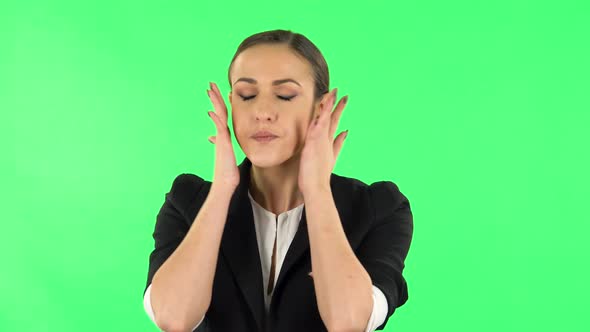 Young Tired Woman Cooling Herself By Her Hand, Suffering From High Temperature Weather. Green Screen