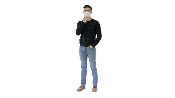 Young Confident Man in Glasses Wearing Protective Mask on White Background.