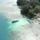 Aerial view of a beautiful island in the ocean with a boat - VideoHive Item for Sale