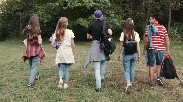 Students Hikers Going in the Forest and Looking for Places