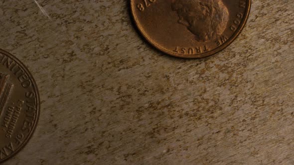 Rotating stock footage shot of American pennies (coin - $0.01) - MONEY 0160