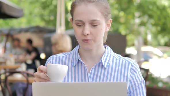 Woman Using Laptop and Drinking Coffee Cafe Terrace