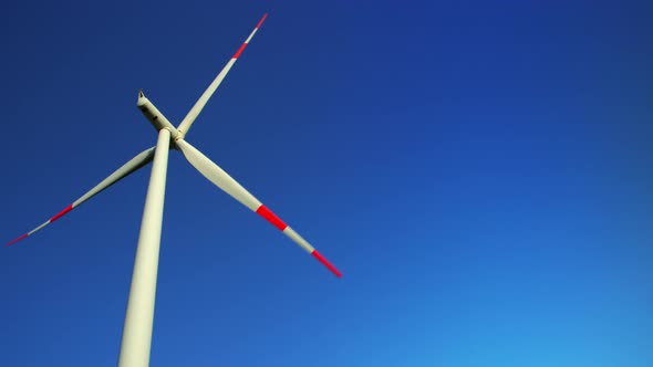 Eco green generator in clear blue sky, aerial view