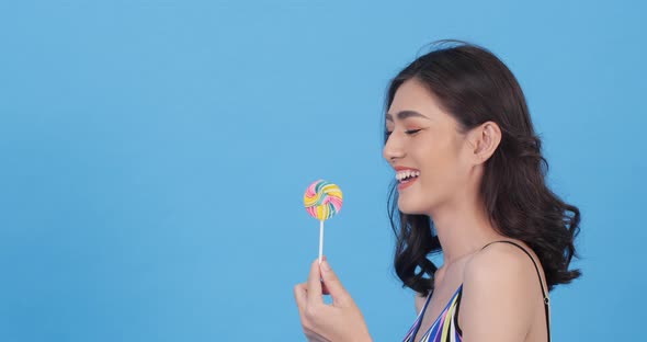 Beautiful woman tasting candy
