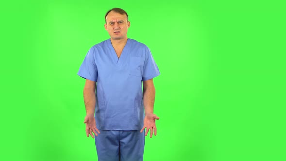 Medical Man Says Wow in Disgust, Negatively Waving His Head, Green Screen