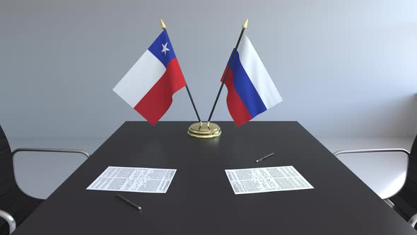 Flags of Chile and Russia and Papers