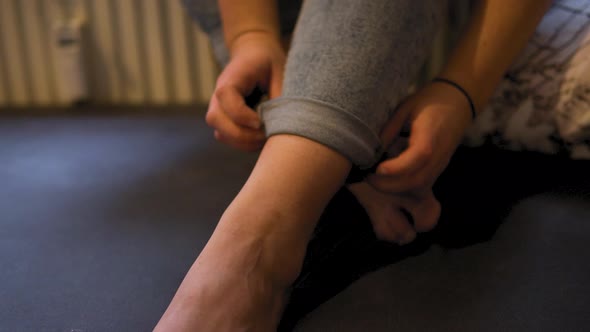 Close up shot of woman the prepares herself for yoga session in her fitness studio. Meditation and r