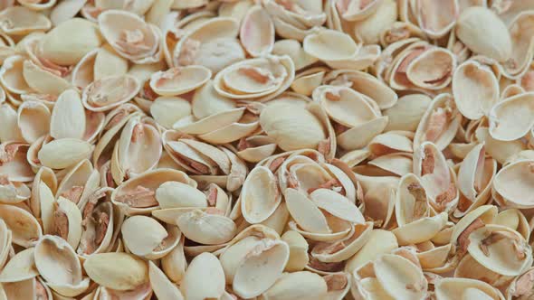 Looped Rotating Empty Pistachios Shells Full Frame Closeup Background