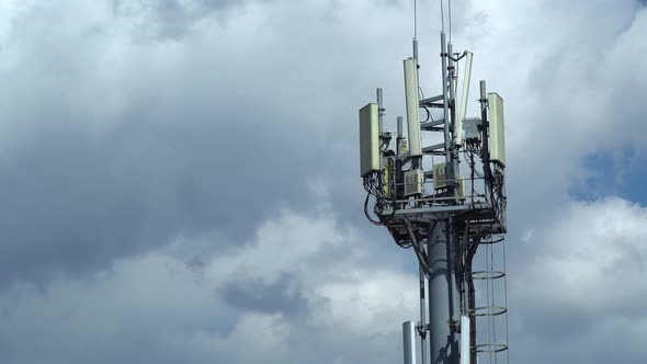 mobile communications tower against the sky. time lapse