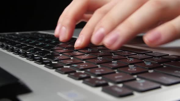 Both Hands of an Office Worker Typing on Keyboard, Front View, Black