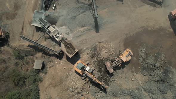 Top View of Heavy Machiery Working at Quarry