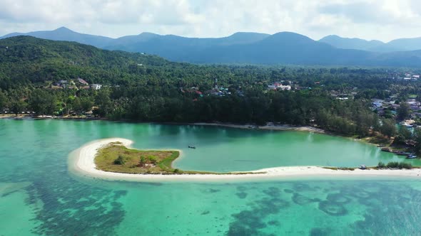 Aerial drone seascape of tranquil coastline beach break by transparent ocean with white sandy backgr