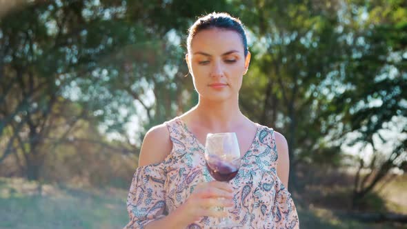 Woman smelling red wine 4k