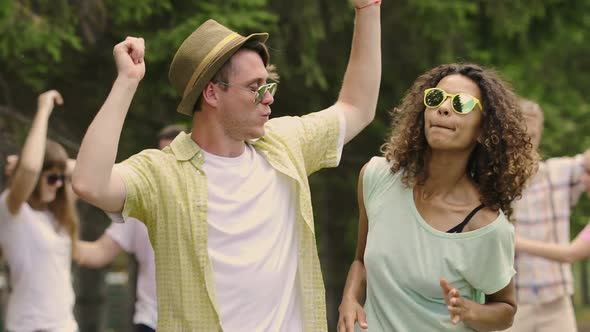 Happy Young People Dancing and Flirting at Outdoor Party, Enjoying Life, Freedom