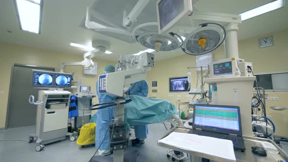 Innovative Medicine Concept. Surgeons Work in a Room with Medical Equipment