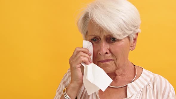 Portrait of Lonely Sad Vulnerable Old Woman Wiping Her Tears