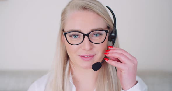 Businesswoman Using Headset In Office