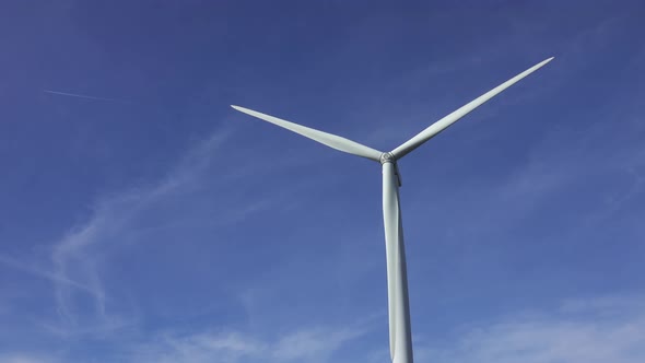 Windmill or Wind Turbine on Wind Farm in Rotation