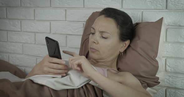 Tired Woman with Telephone