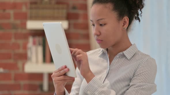 Portrait of African American Woman Using Tablet