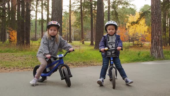 Portrait of Cute Children on Balance Bikes