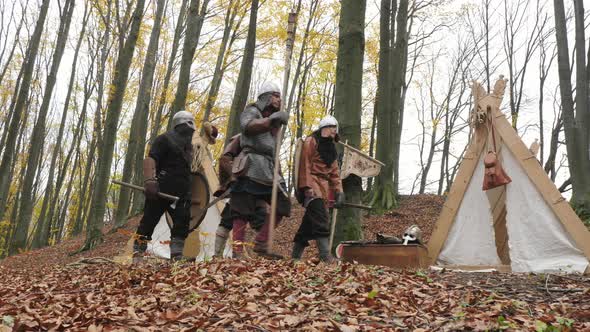 Viking warriors leaving their camp