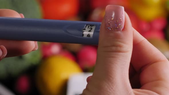 Closeup of a Woman Gaining the Right Dose of Insulin on an Insulin Pen