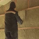 Man laying insulation in a wall under roof - VideoHive Item for Sale